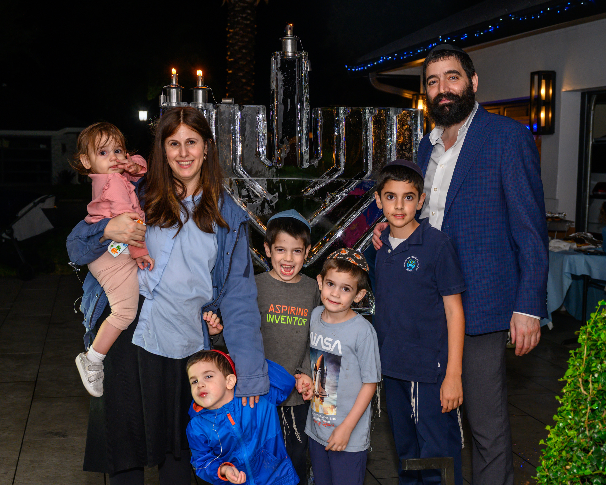 Rabbi Arele and Chaya Gopin with their family at a Chabad Chai Center Chanukah celebration
