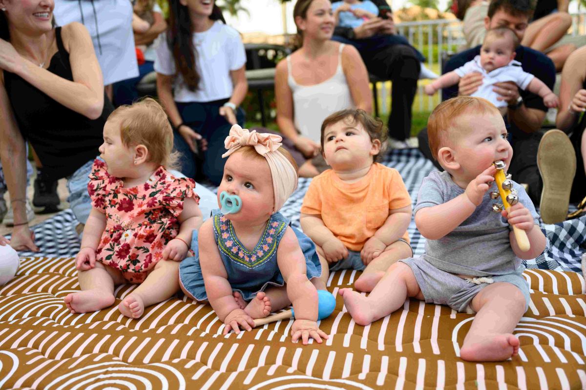 Young children and parents together at Chabad Chai Center’s Pre-Shabbat Sing-Along