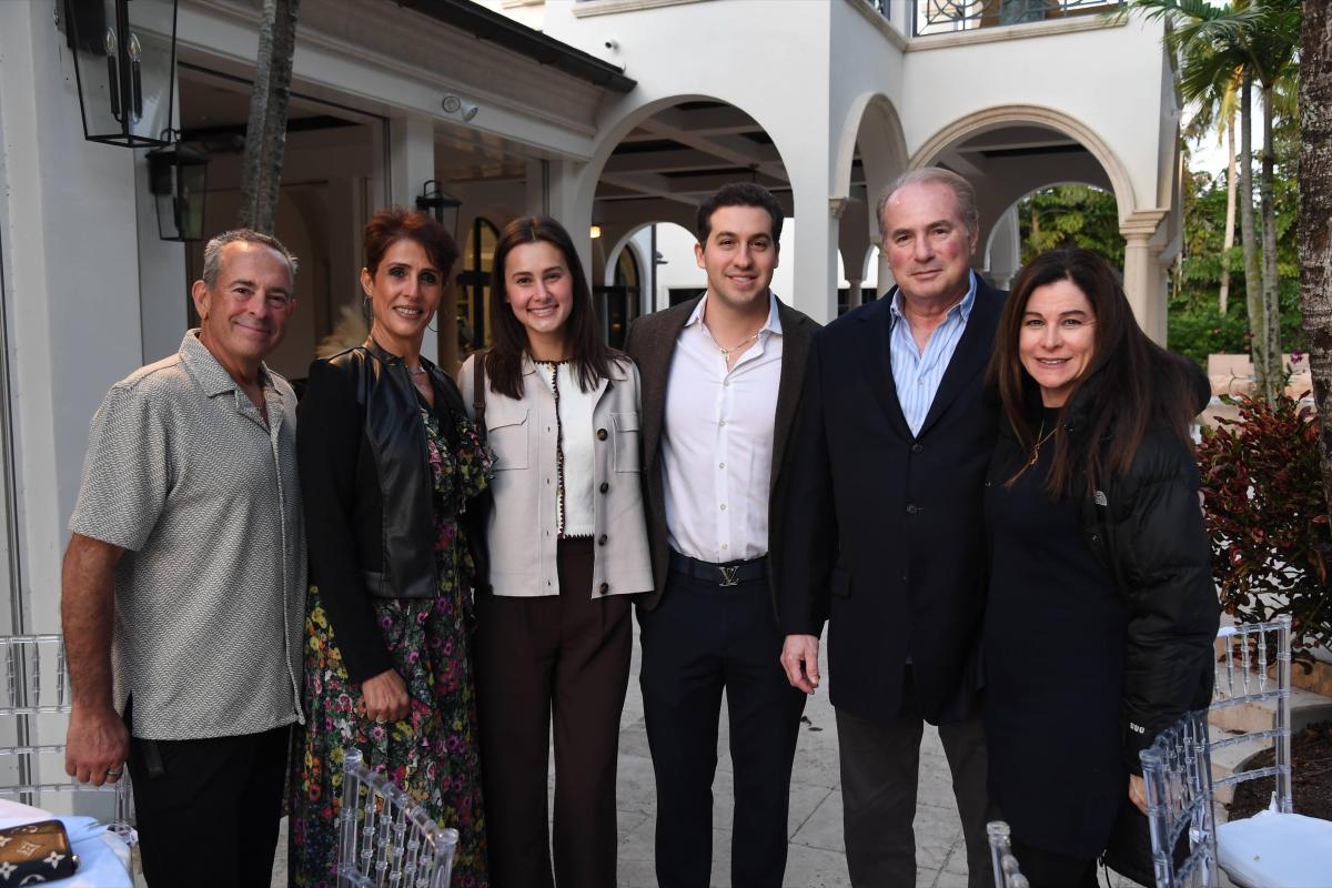 Community members celebrating a Torah dedication together