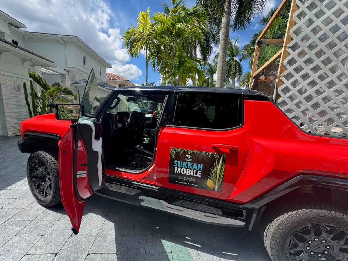Our red mobile sukkah bringing the holiday to homes and offices